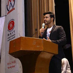 Vinay Batra speaking at a podium
